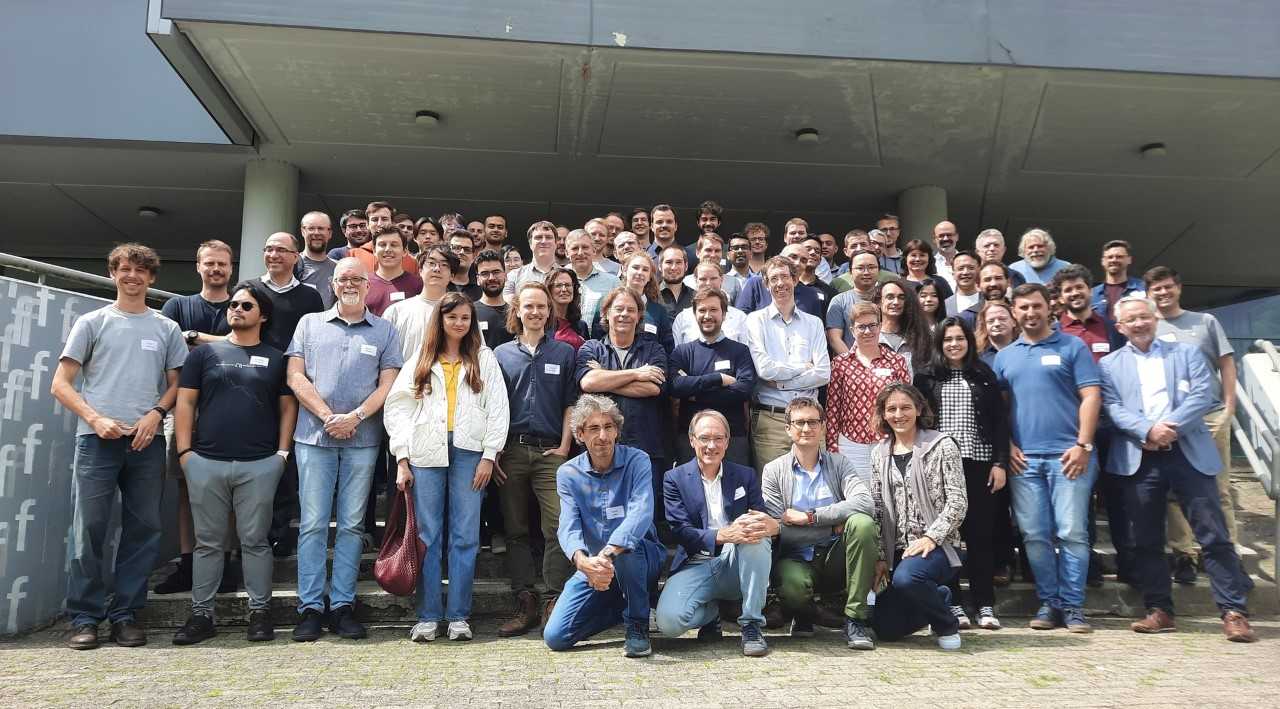 Group picture taken on the stairs of the ZiF at ISIPTA 2025.